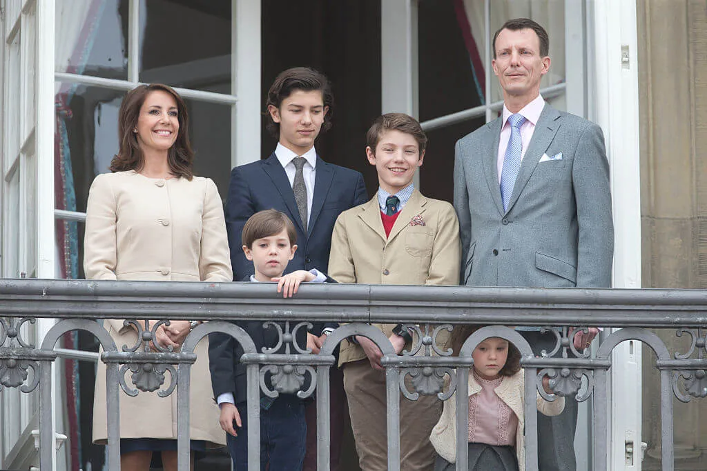 Princess Marie standing with her family on a balcony at the Queen Margrethe II of Denmark's 76th Birthday Celebration