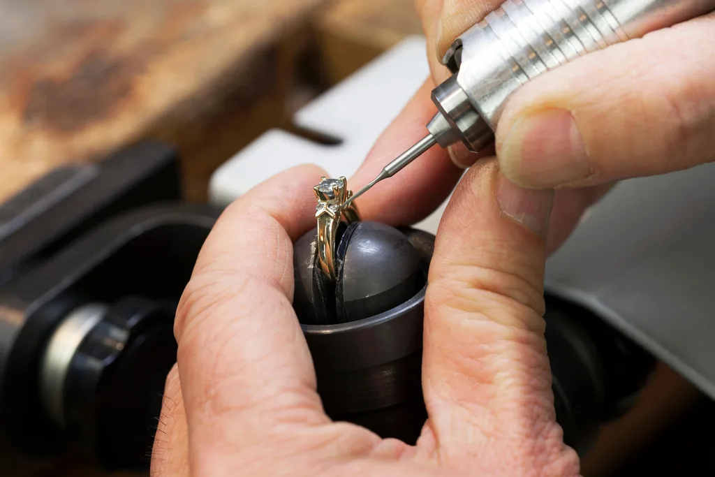 A jeweller cutting a diamond