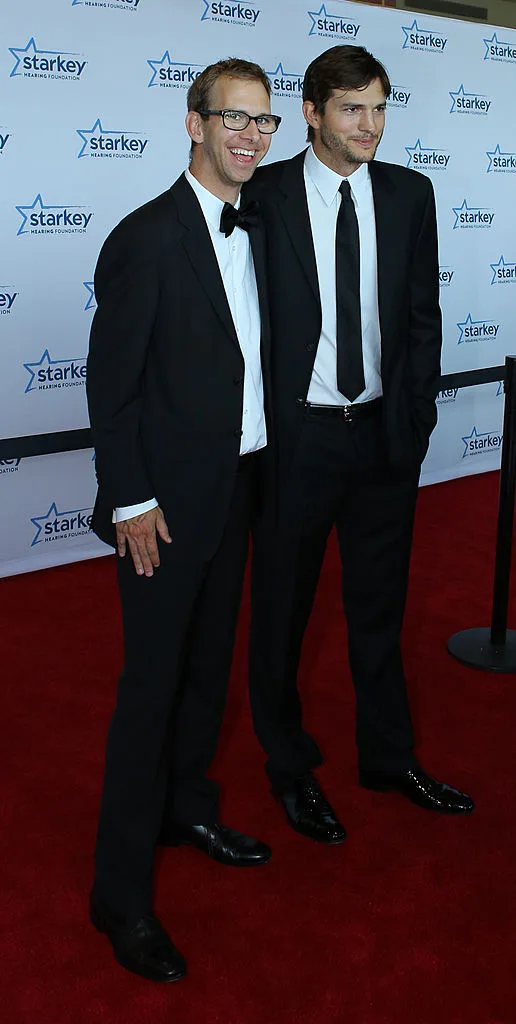 Michael Kutcher and brother Ashton Kutcher together on the red carpet of Starkey Hearing Foundation 2013