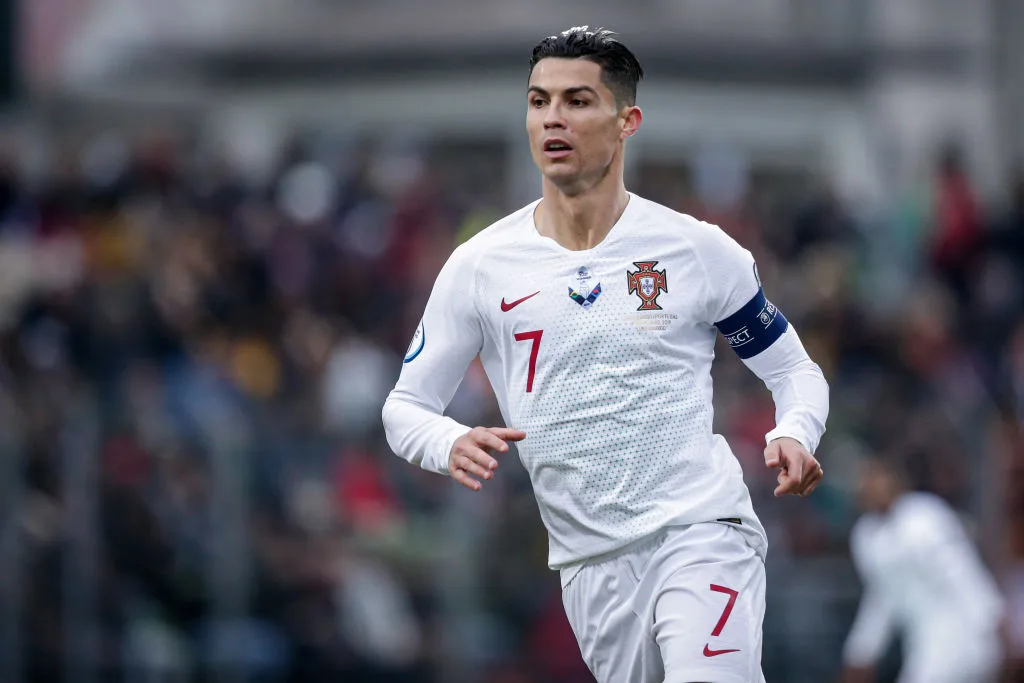 Cristiano Ronaldo in a white soccer guernsey