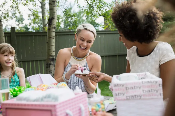 Two woman and a daughter at a baby shower
