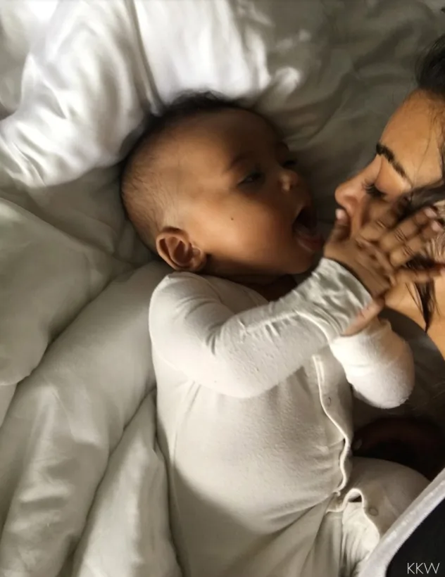 Kim cuddles up to her son Saint West
