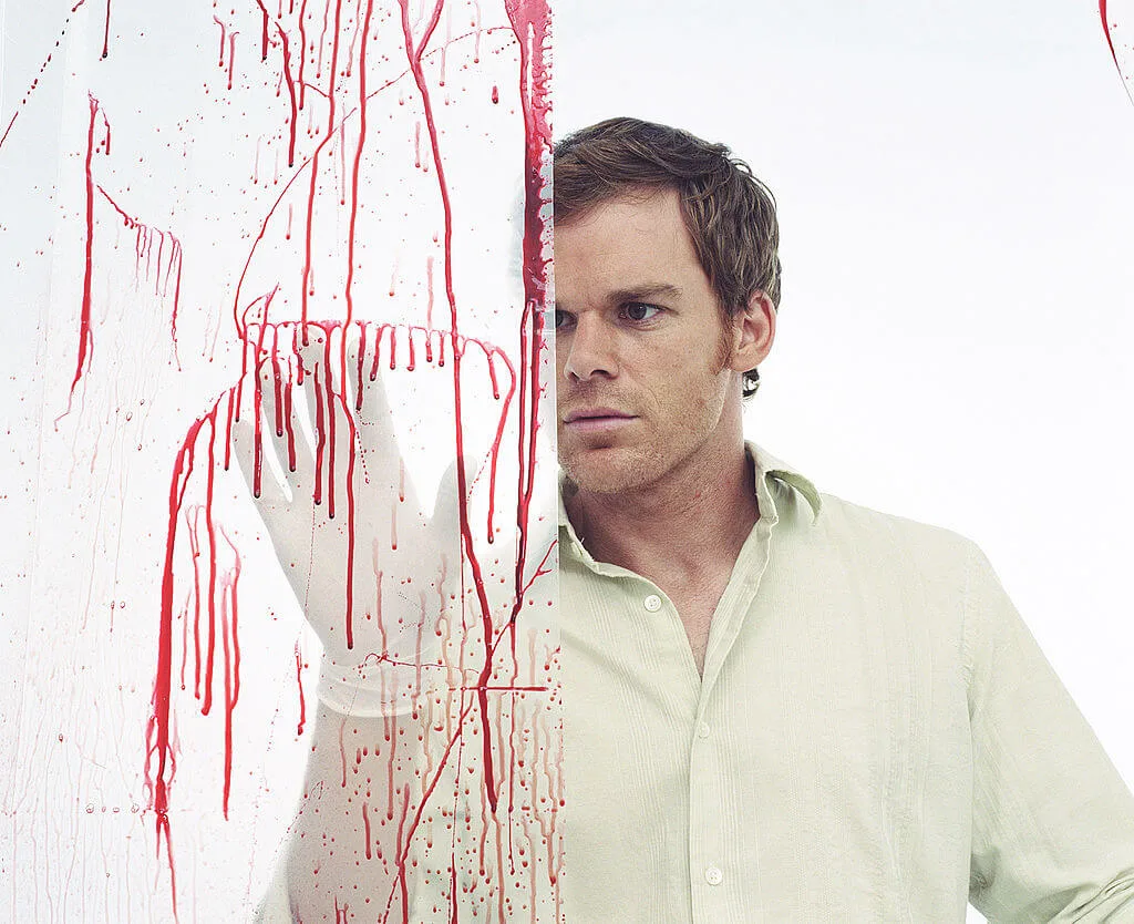 Dexter Morgan, from the TV show Dexter, looking at blood on a glass wall