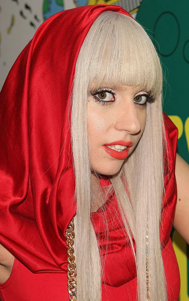 Lady Gaga in a red hood backstage at the MTV Total Request Live event