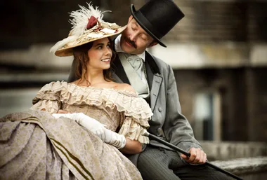 A couple wearing Victorian era clothing