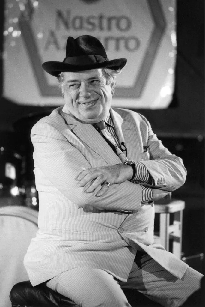 A black and white portrait of George Melly