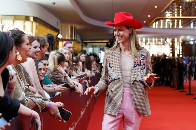 Christian Wilkins' most recent ARIAs outfit, comprised of a stunning red cowboy hat that stopped many in their tracks.