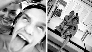 Miley Cyrus and Cody Simpson goof off on an athletic table