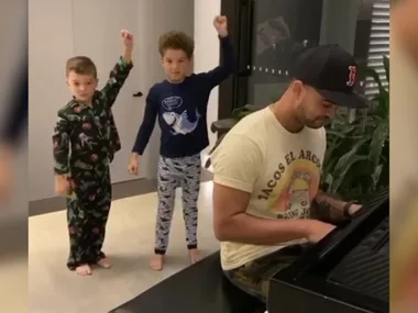Guy and Jules Sebastians kids dance along in their living room