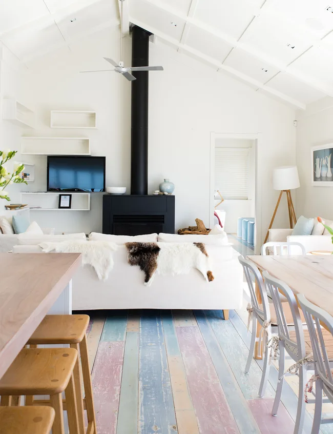 Coloured floorboards were sanded back and limewashed, providing subtle yet cheerful colour in the upstairs living area.