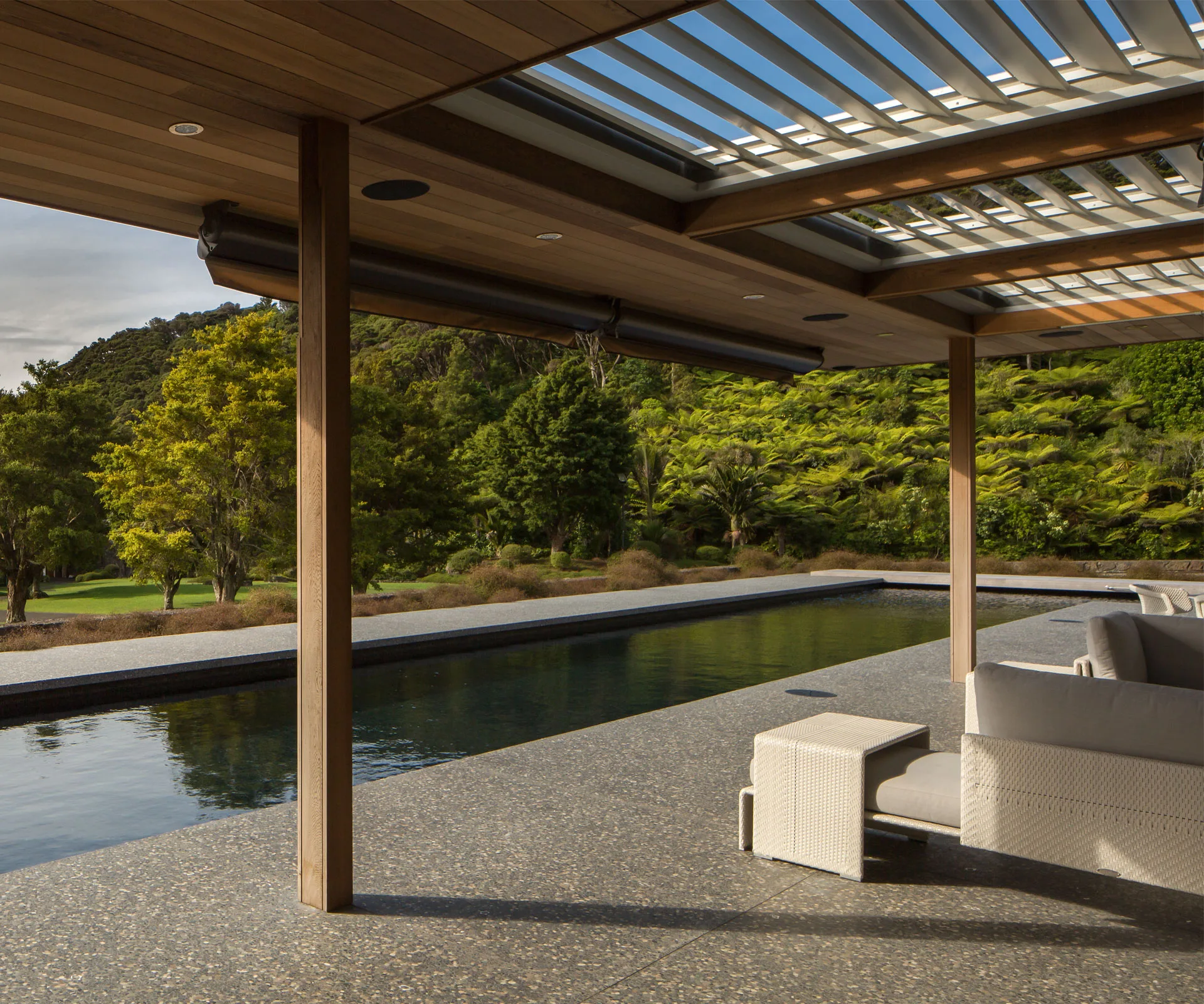 Pool 4. Built-in Louvretec aluminium louvres allow sunlight to be modulated on the outdoor seating area adjacent to the pavilion. Photography by Samuel Hartnett.