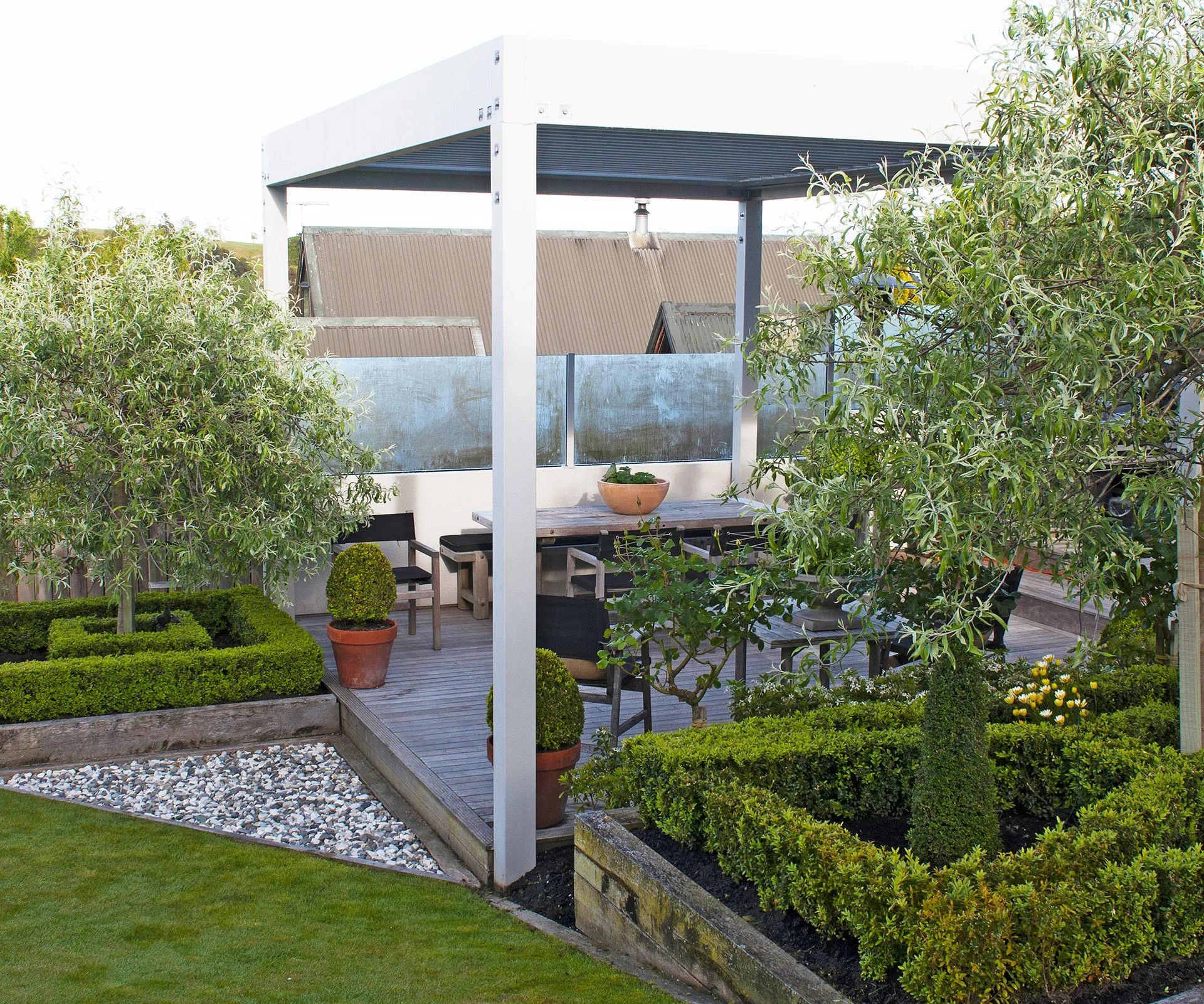 Dianne loves the deck area with its louvred canopy and views over the garden to the Wither Hills.