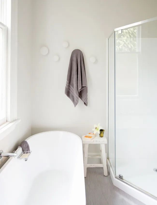 In the family bathroom white Muuto &lsquo;Dots&rsquo; (handy for hanging towels) soften the look.