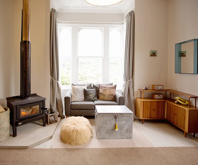 A mix of texture, contrast, colour and art fills this weatherboard beauty in the living room.