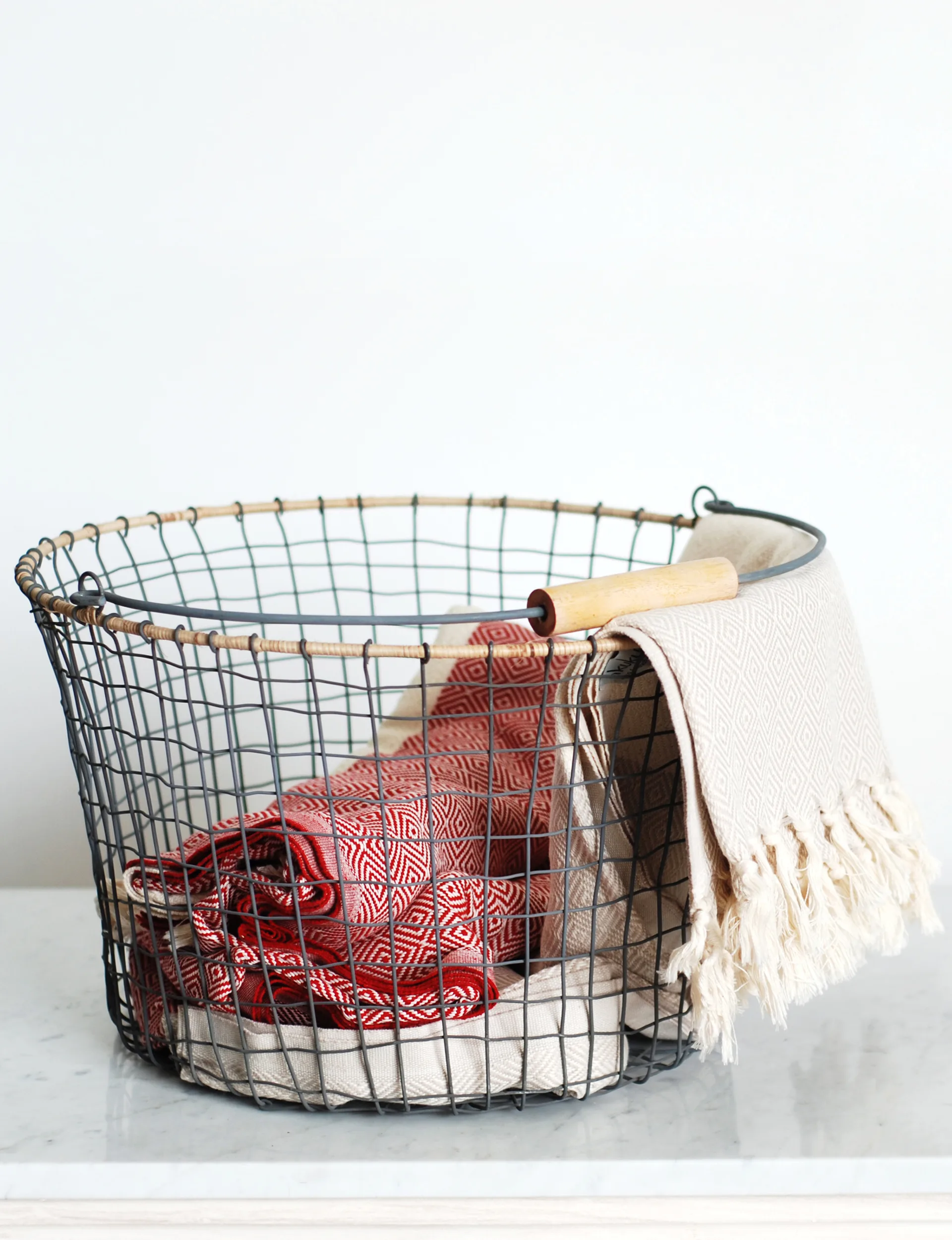 Nkuku-metal-and-wicker-basket,-$119,-from-Perch-Home