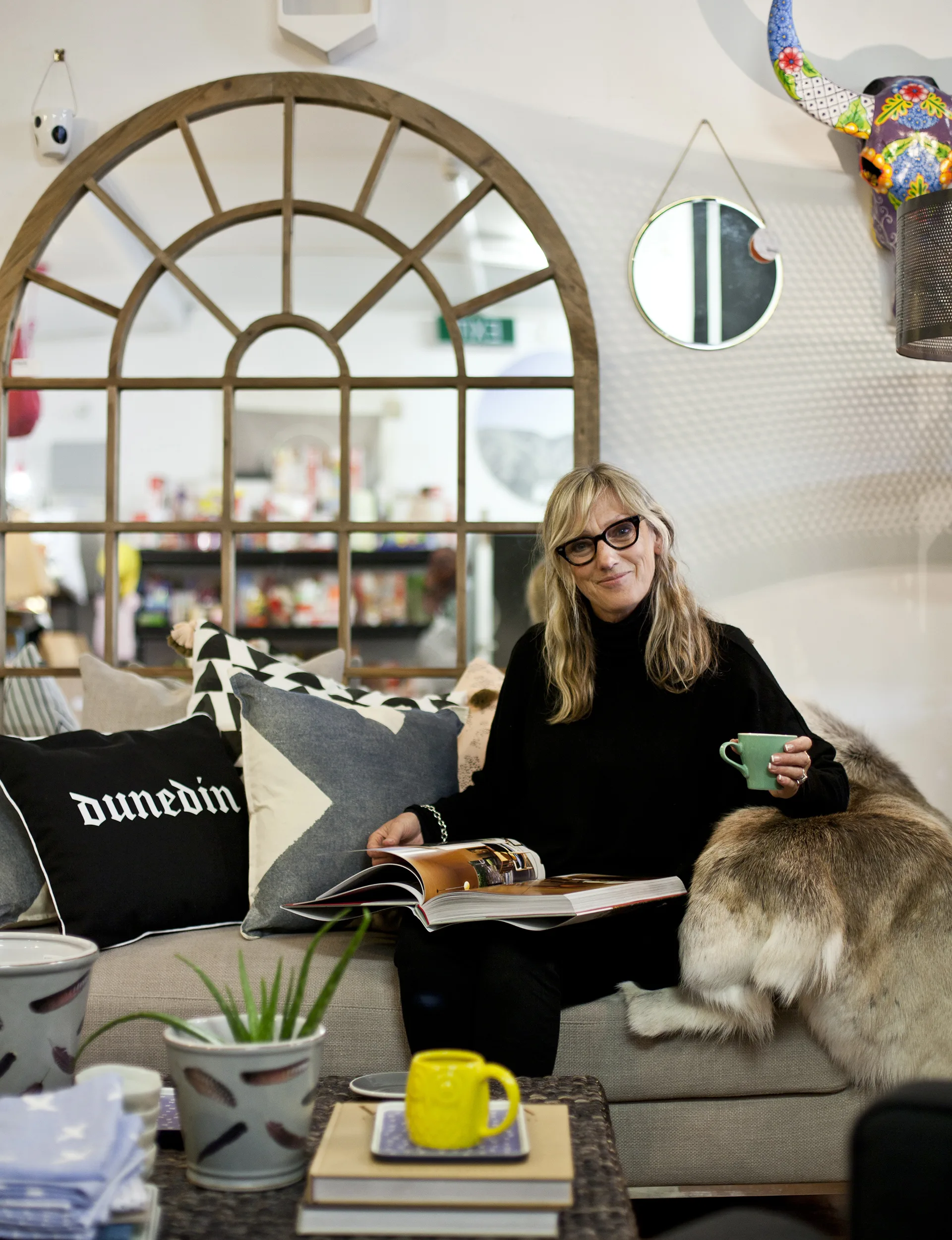 Sandy Cubitt, Moi on George’s in-house interior designer, relaxes amid the wealth of furnishings sourced by daughter Courtney.
