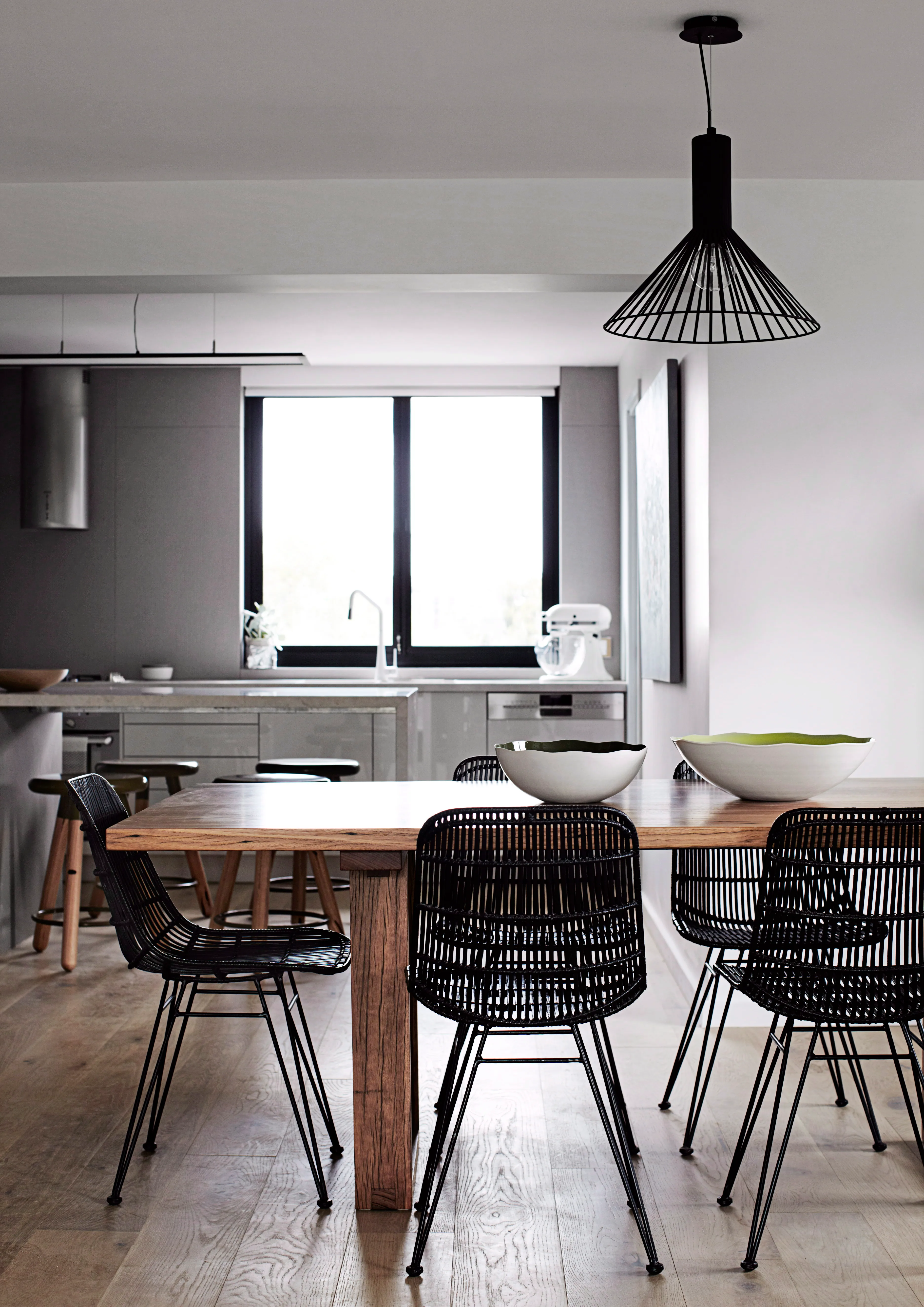 “Our look is quite contemporary and almost a little quirky, but we also incorporate industrial elements,” says Madi. Jarrod made the dining table himself; the chairs are by HK Living.