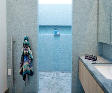 A $30,000 bathroom renovation is a vision in blue mosaic tiles