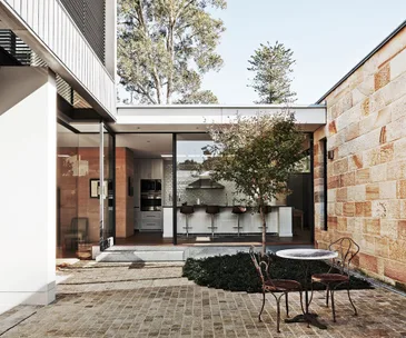 This sandstone cottage has a rather surprising modern addition
