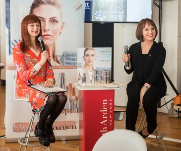 Naomi speaking with Elizabeth Arden's Liden Erasmus.