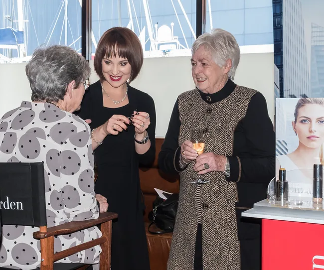 Elizabeth Arden's Liden Erasmus doing a guest's make-up at the event.