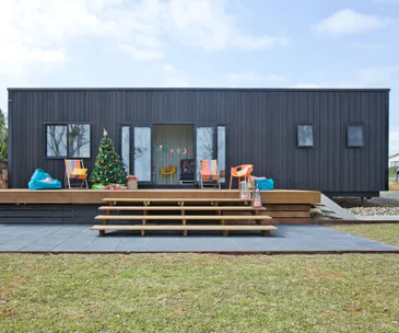 Discover the creative force behind this shipping container bach
