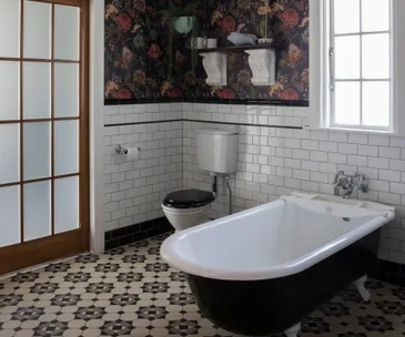 A dated bathroom gets a modern makeover with an antique edge