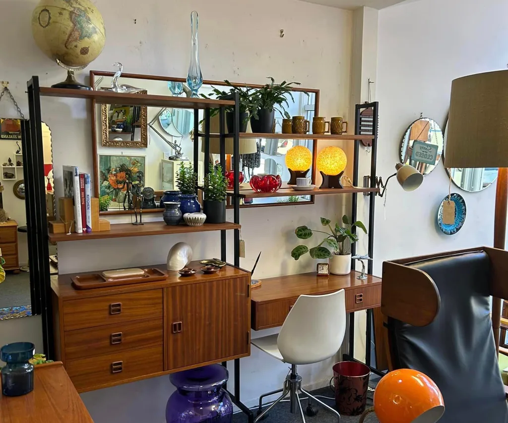 A mid-century bookcase and storage unit against a wall in Add+Vintage in Wellington.