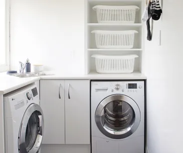 Inside a bright laundry room with loads of functional style