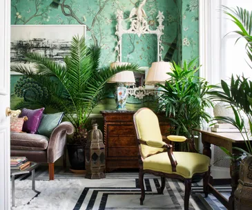 Hand-painted wallpaper and exquisite vintage furniture fill this fairy tale home