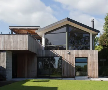 Chic cladding has given this 1970s Taranaki home an impressive new look