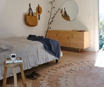 The soothing interior style of this Waiheke Island bach makes relaxing easy