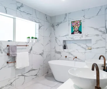 See how this tired bathroom in Kaiapoi received a luxe tile update