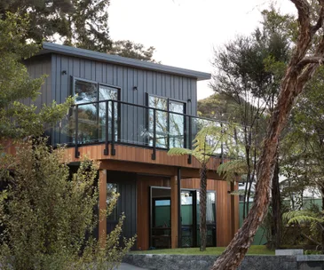 The stylish combo of black and cedar gives this family home a modern feel
