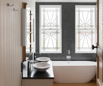 Two windows rescued from Trademe add major character to this bathroom