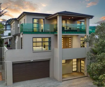 This grand home for sale in Mairangi Bay is a luxurious coastal retreat