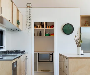 This modern kitchen utilises hard-wearing materials in the most stylish way