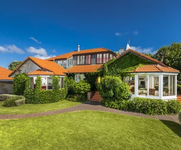 This clifftop Devonport home has the best views and private beach access
