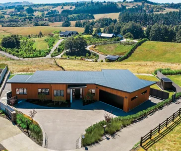 Country life calls at this modern Pukekohe home with incredible views