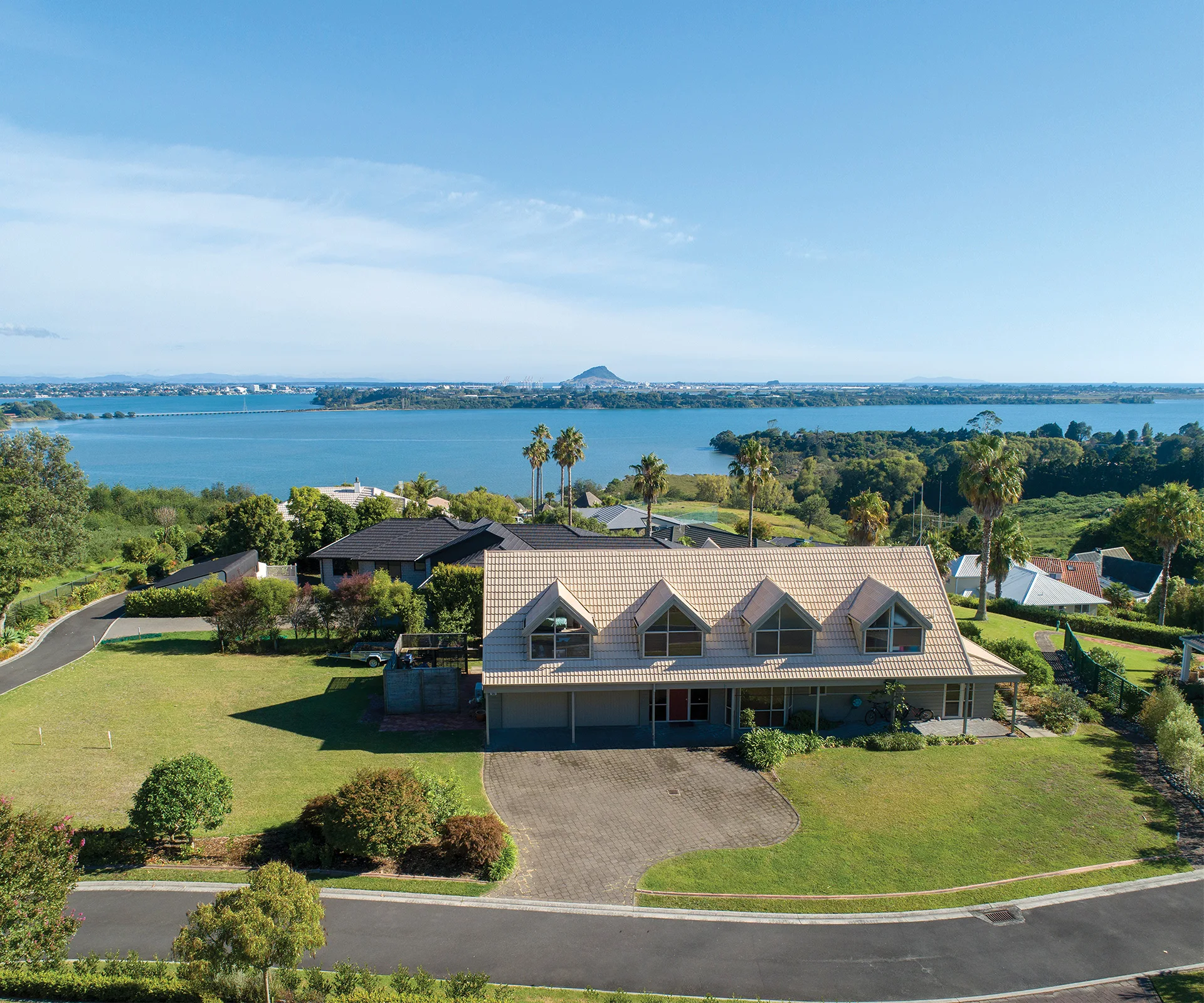 Enjoy views of Tauranga harbour in this spacious gated community home