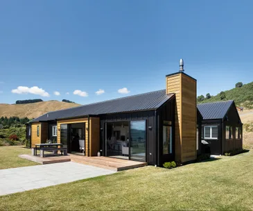 Why this black-clad Taupo home was designed with two master bedrooms