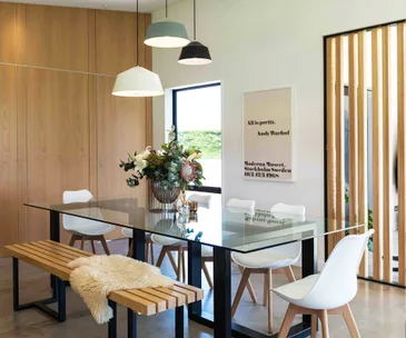 How concrete, metal and timber is warm and welcoming in this chic home