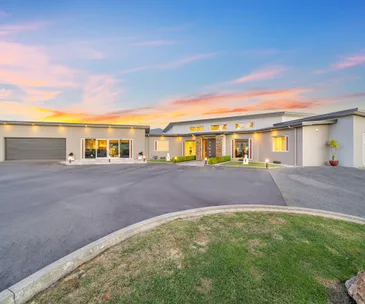 This home offers rural living, panoramic views and plenty of garage space