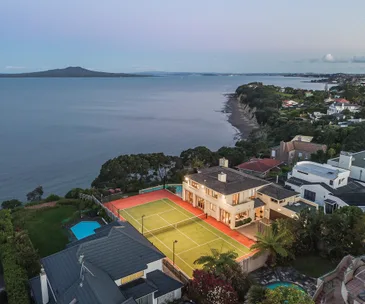 This impressive clifftop home has a pool, tennis court and stunning views