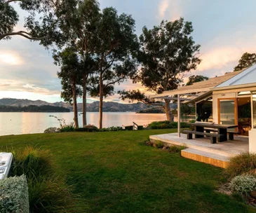 Enjoy peaceful waterfront living at this Charteris Bay home for sale