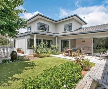 This sun-filled Bay of Plenty home has enviable golf course views