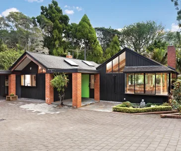 This cedar-clad St Heliers home for sale sits in the most tranquil setting