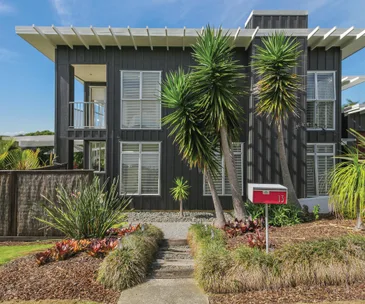This Beachlands home for sale is quintessential kiwi living on the coast
