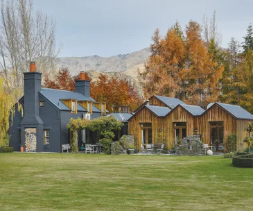 This grand Arrowtown home offers lodge-like living on picturesque grounds