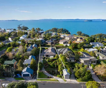 This modern home by the beach is in zone for Macleans College